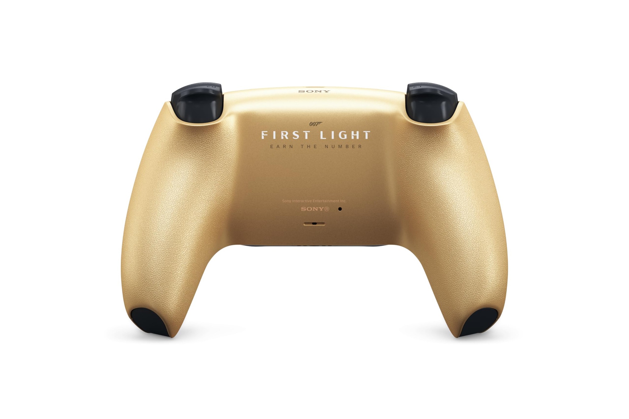 Black and gold wireless game controller on dark slate