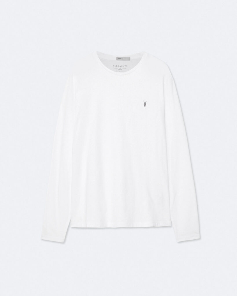White long-sleeve undershirt folded beside a grey wool sweater