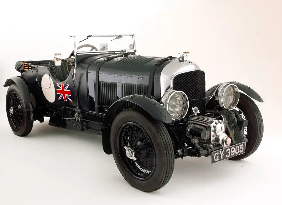 Supercharger and leather bonnet strap on a vintage green Bentley 4.5 Litre