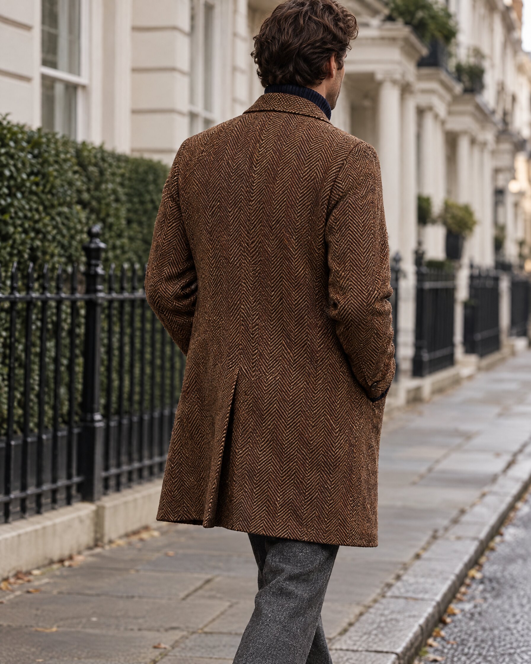 Man in a Billy Reid Astor coat style single-breasted overcoat walking down a London street