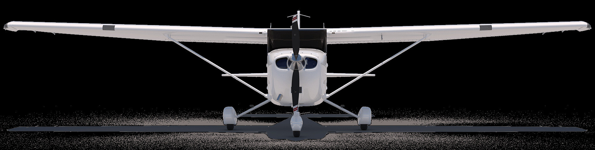 White high-wing light aircraft parked on a grass airstrip at dawn