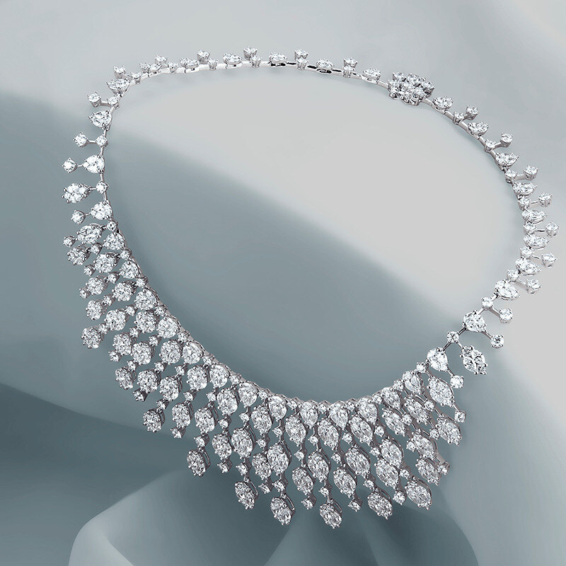 Platinum and white diamond scoop necklace on grey velvet