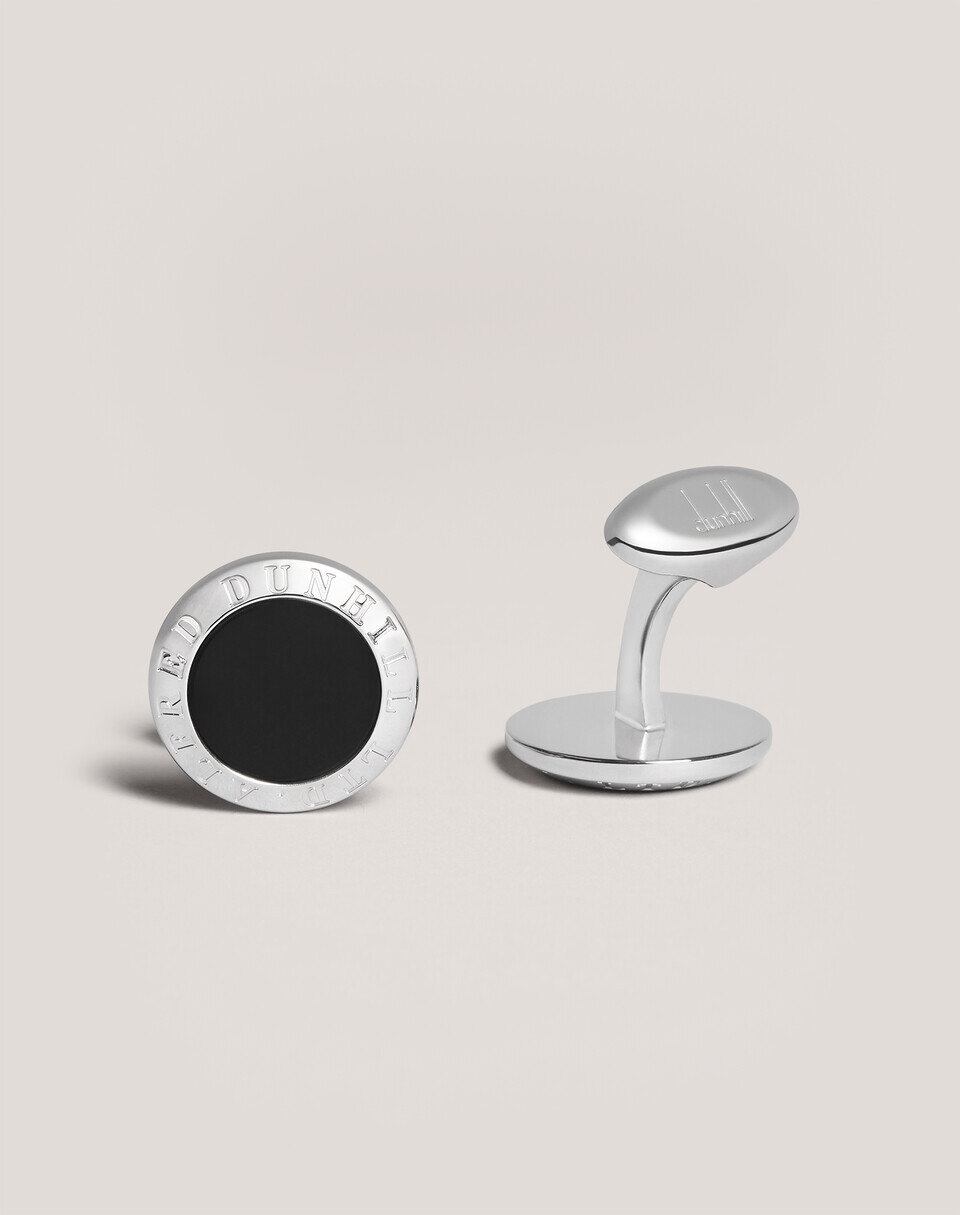 Dunhill style L-shaped metal cufflinks on a white double cuff