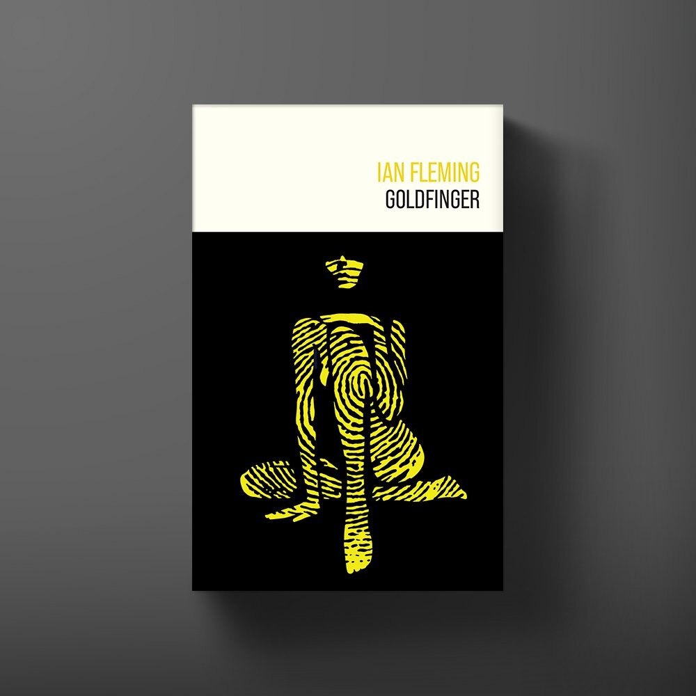 Goldfinger hardback novel on a leather desk top