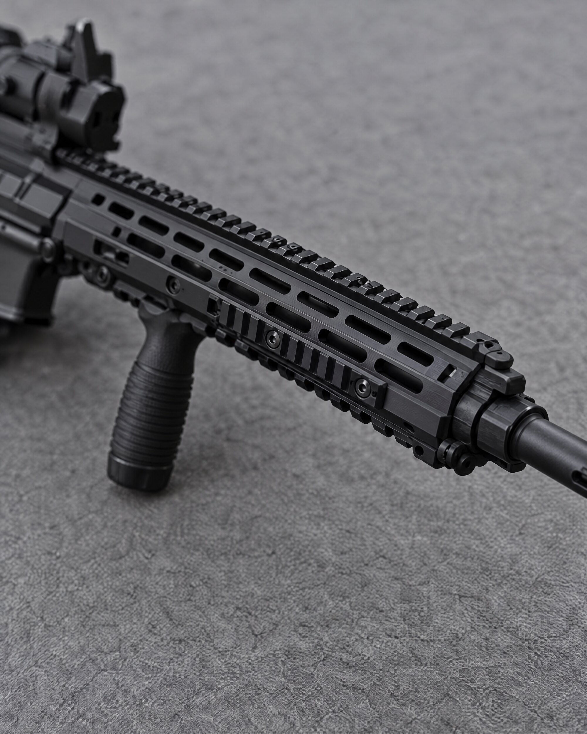 Detail of the slim handguard and rail on a black Heckler & Koch HK416 style rifle