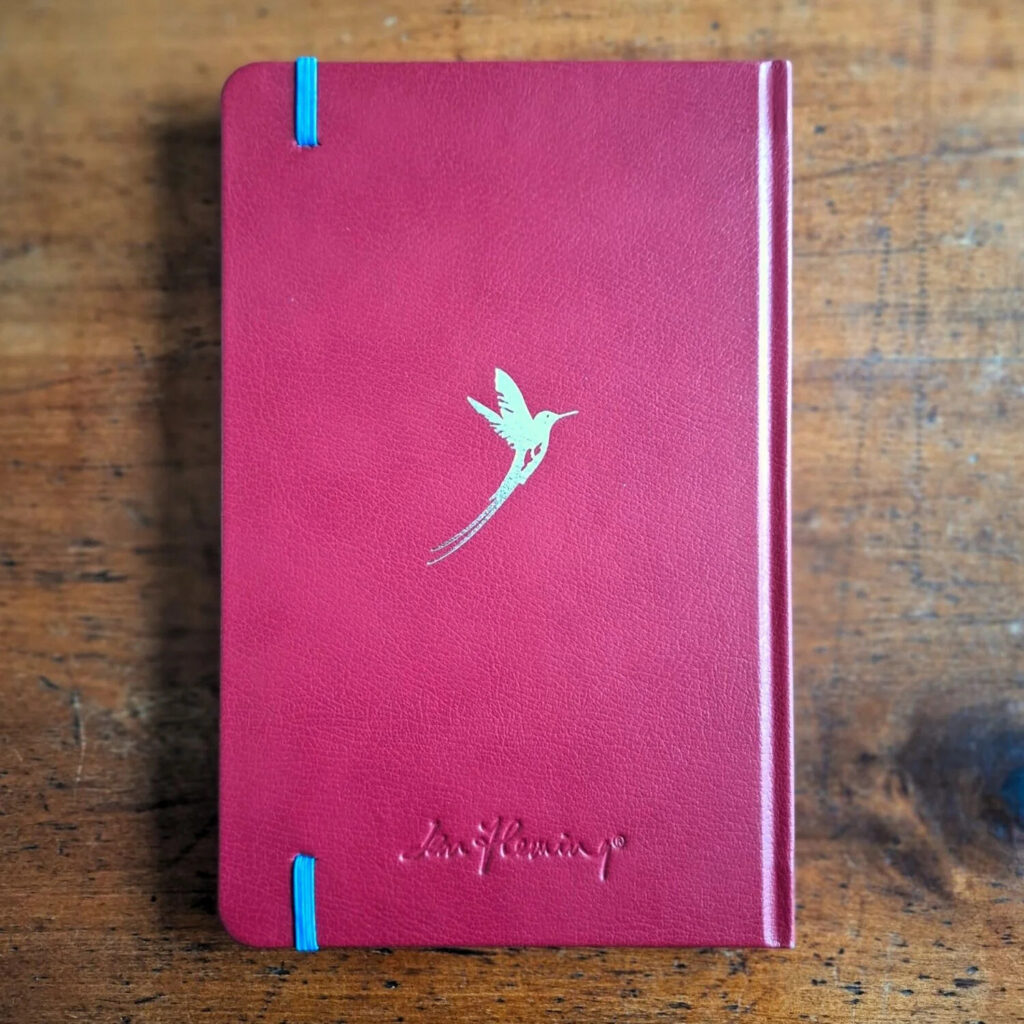 Leather notebook in the spirit of the Ian Fleming Japan notebook, on a walnut desk