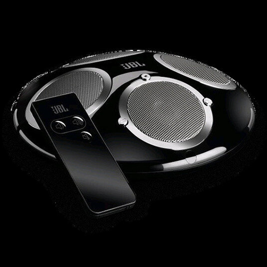 JBL On Tour XTB speaker in black with chrome-silver speakers on an oak surface