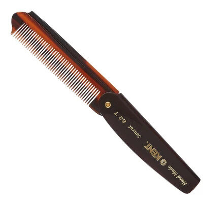 Kent brush and comb laid on a marble bathroom shelf