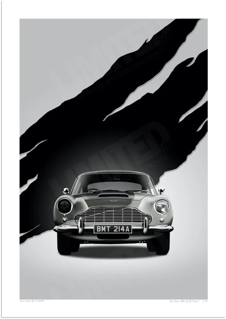 Framed Aston Martin DB5 BMT 214A style print hanging above an oak console table