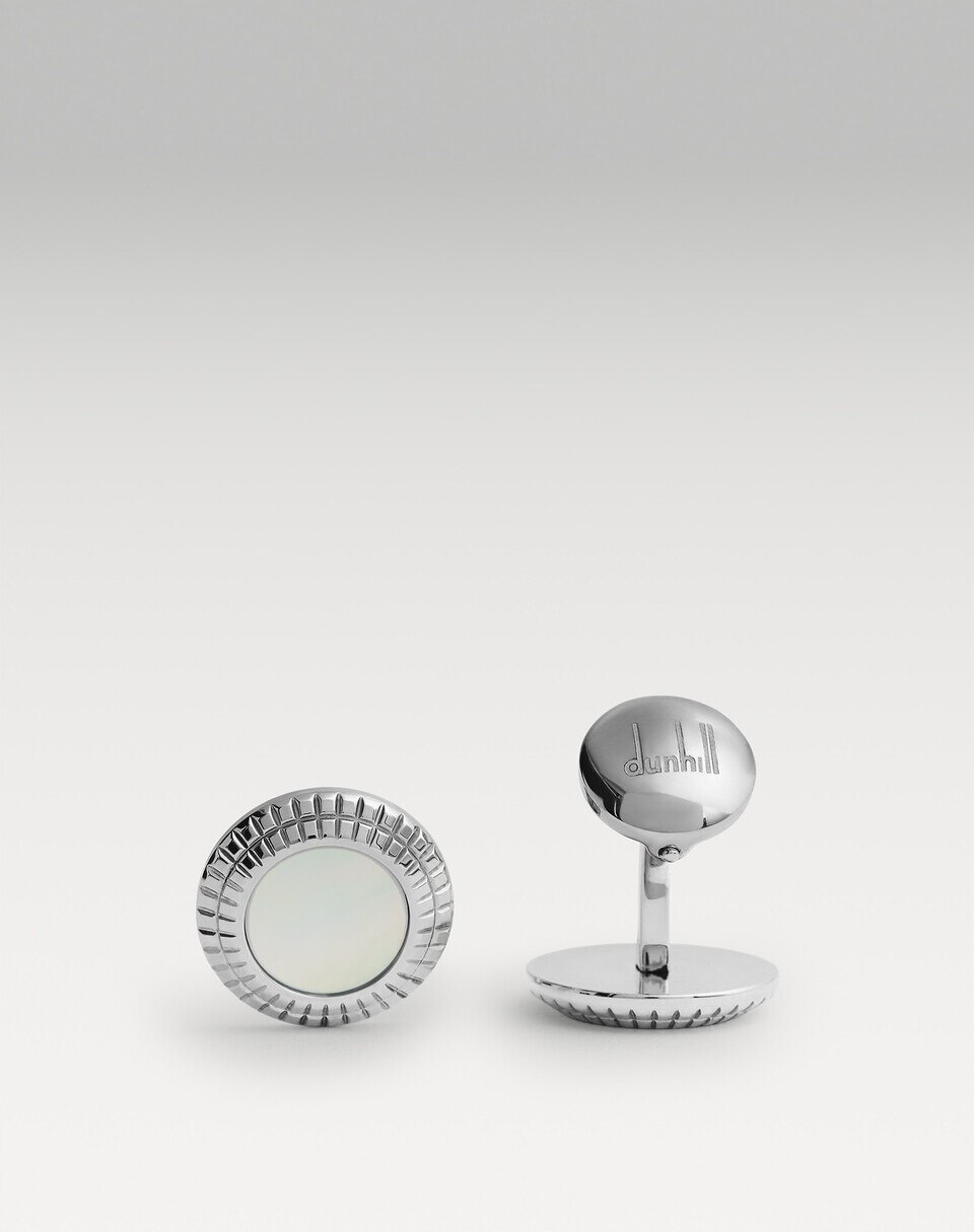 Dunhill mother of pearl cufflinks in close detail on a white double cuff