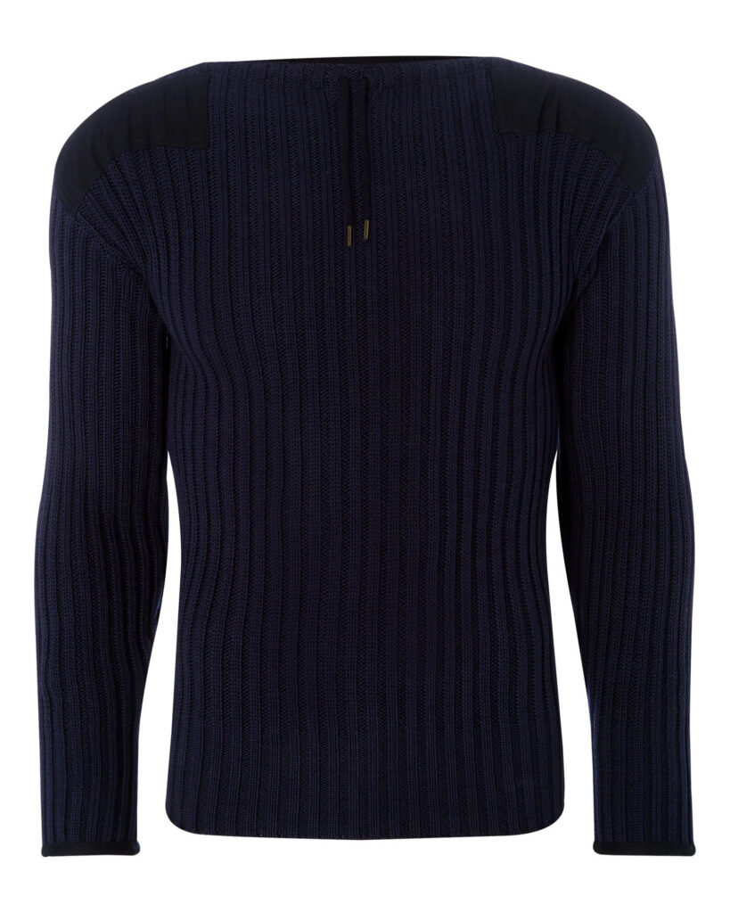 Navy cashmere cable crew neck sweater folded on oak with a driving glove