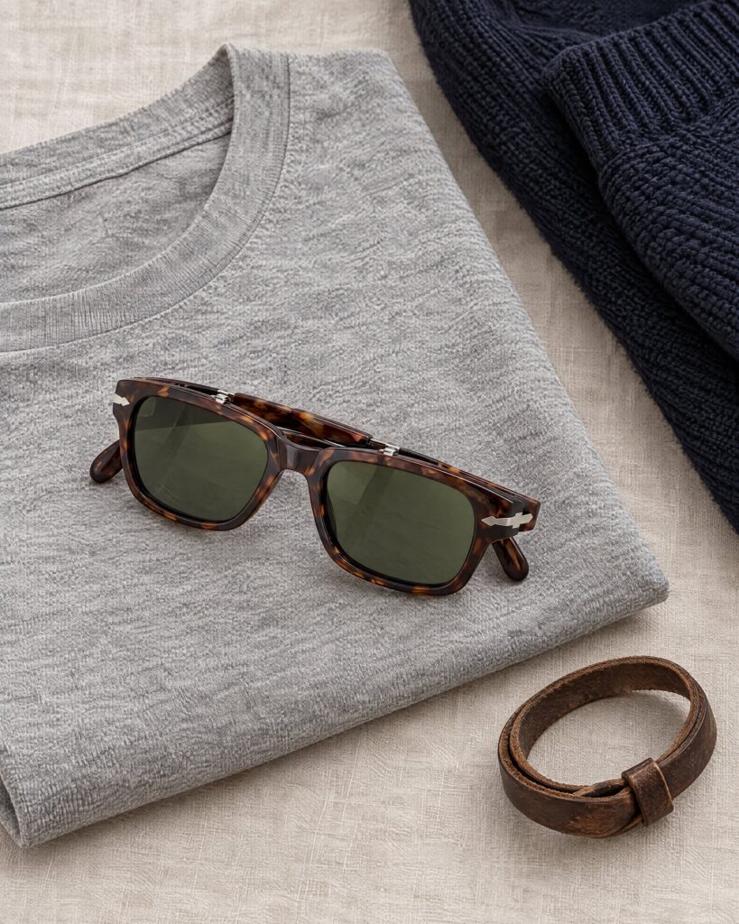 Persol 2720 sunglasses with tortoise frame and green lenses on a grey t-shirt and navy knit