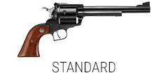 Blued single-action revolver on a leather desk blotter