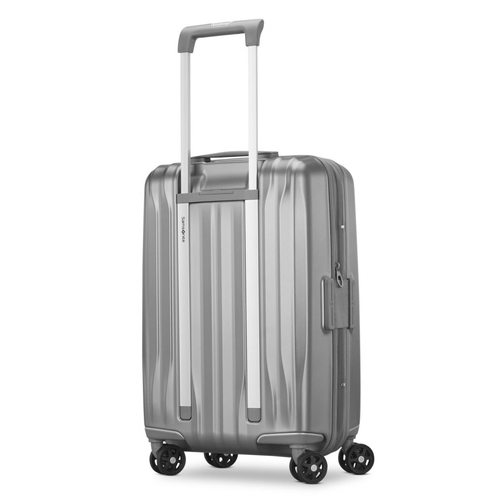Samsonite custom suitcase style brushed aluminium case on a stone floor