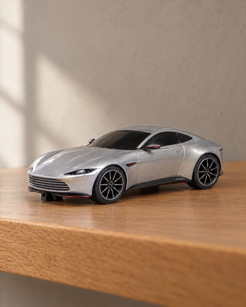 Scalextric Aston Martin DB10 slot car in silver-grey on an oak shelf