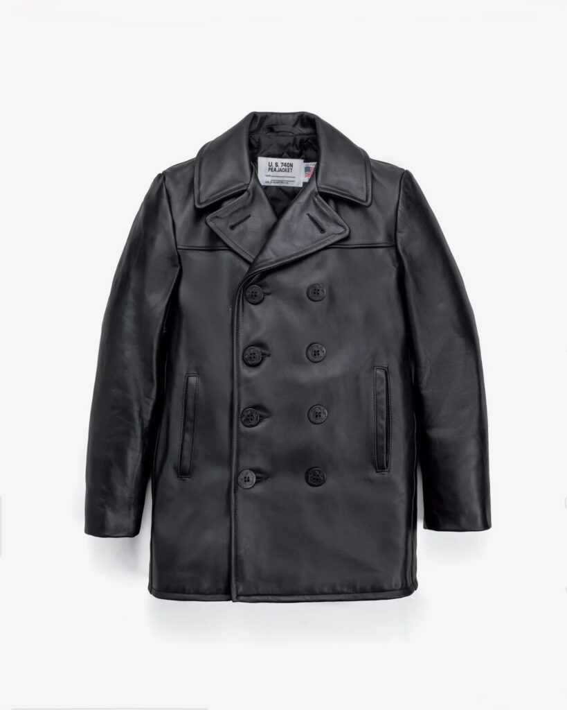 Black leather naval peacoat with anchor buttons on a wooden hanger