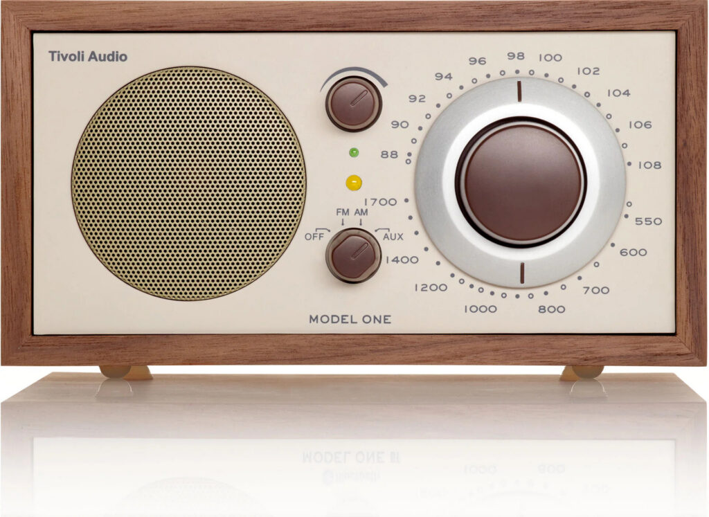 Tivoli Audio Model One Bluetooth radio in walnut on an oak sideboard in a sunlit room