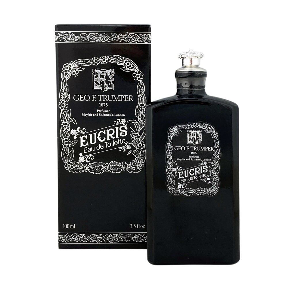 Trumper Eucris Eau de Toilette black glass bottle on a marble shelf