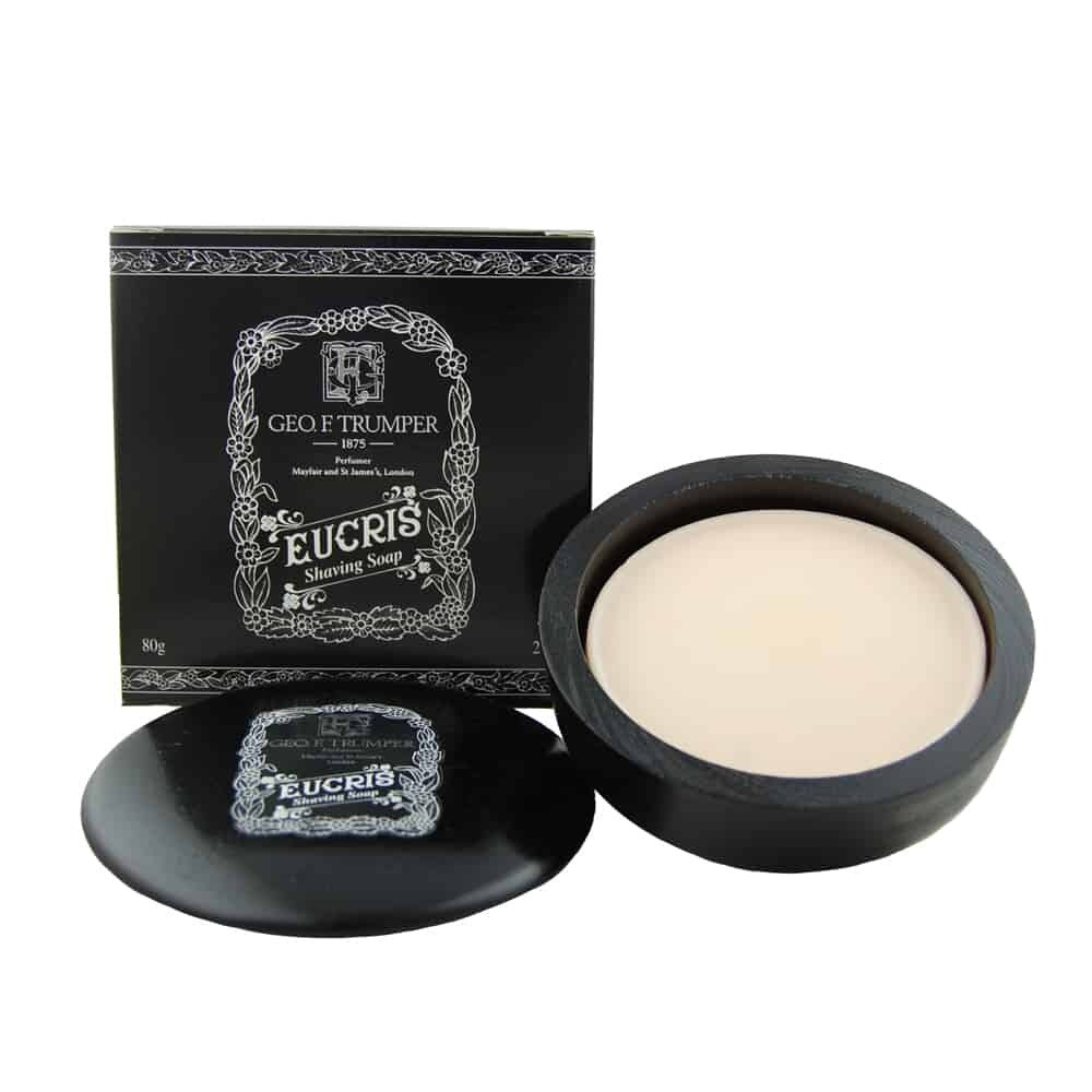 Trumper Eucris shaving soap in a black wooden bowl on a marble washstand