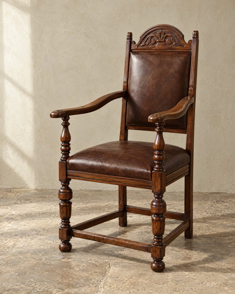 Tudor Oak Greenwich Early English chair in coffee brown hide with a turned wooden underframe, on a stone floor