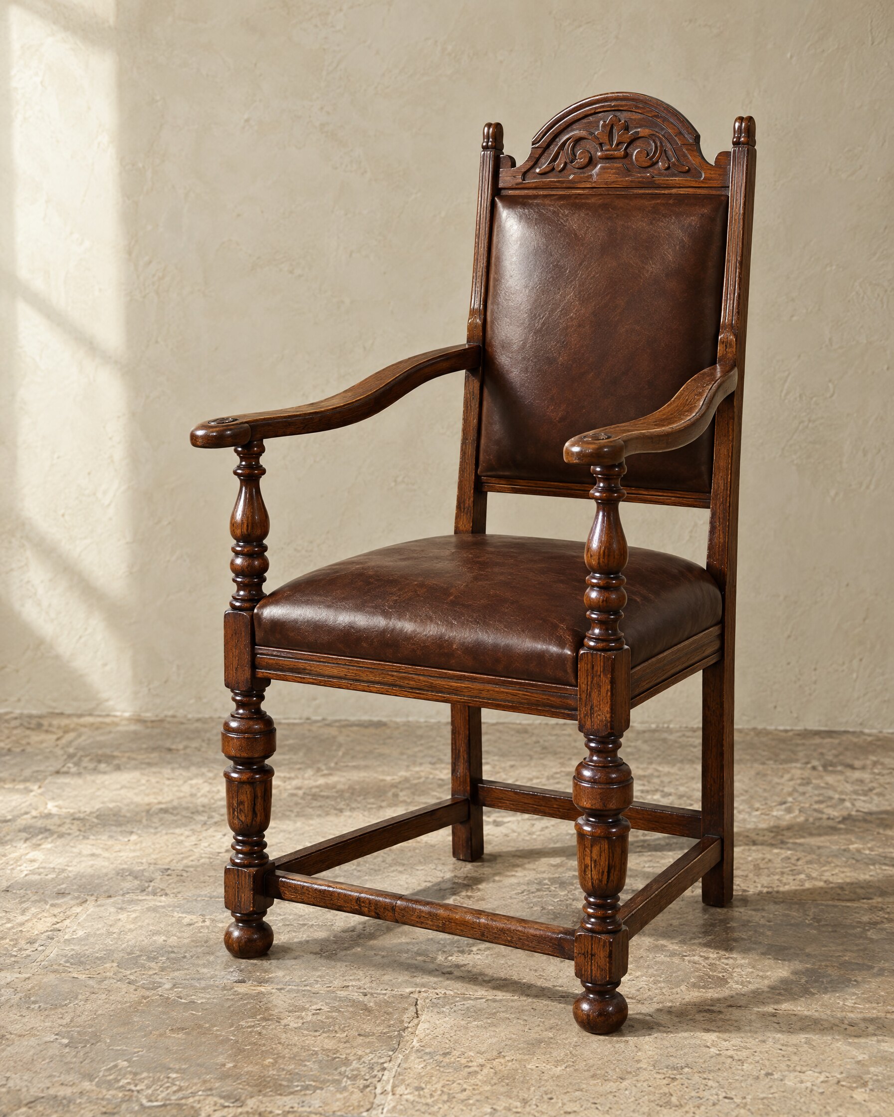 Tudor Oak Greenwich Early English chair in coffee brown hide with a turned wooden underframe, on a stone floor