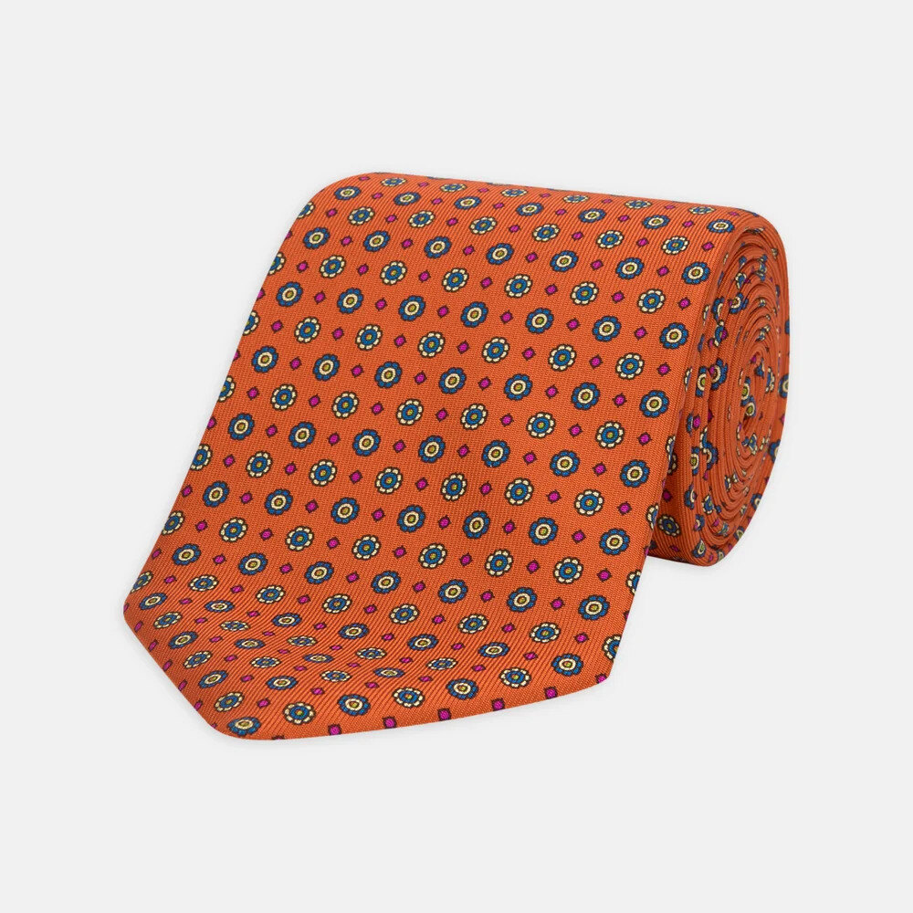 Turnbull & Asser style tie with red and burnt orange squares laid flat