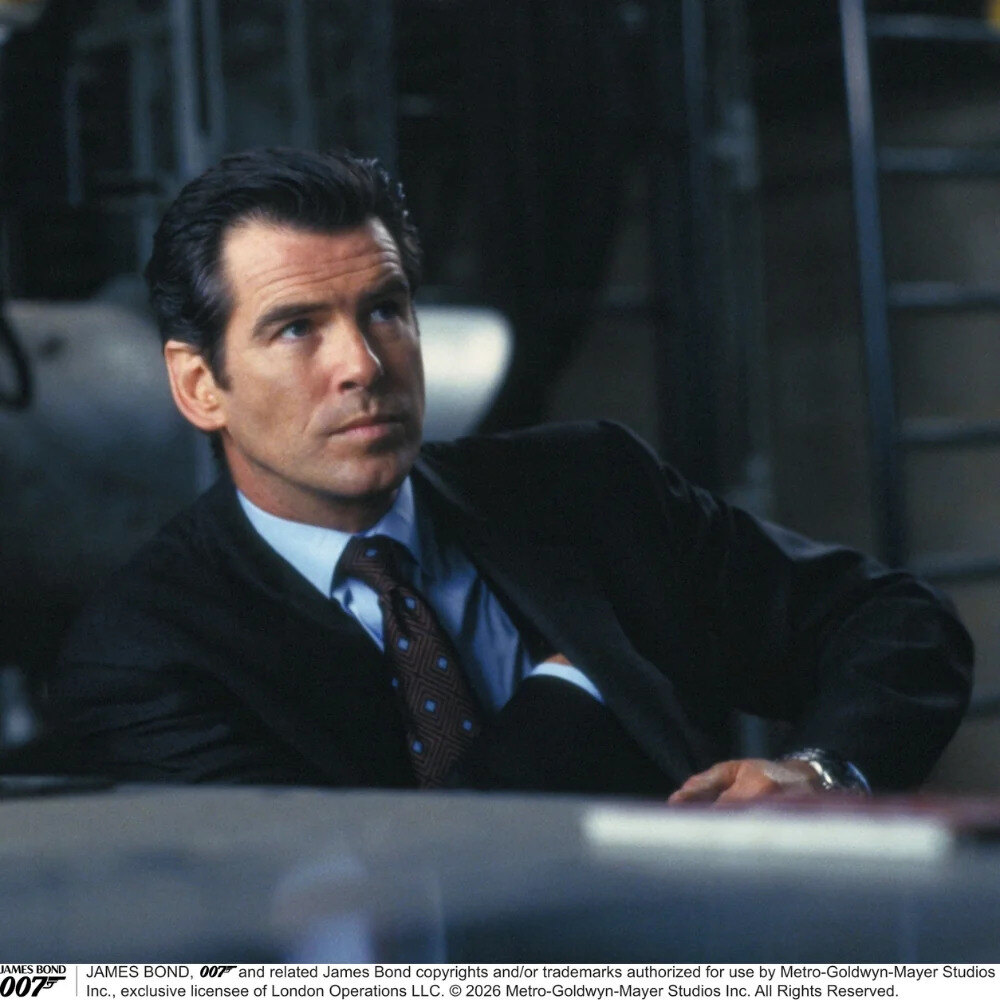 Turnbull & Asser Tomorrow Never Dies tie in navy, brown and sky blue squares, flat lay
