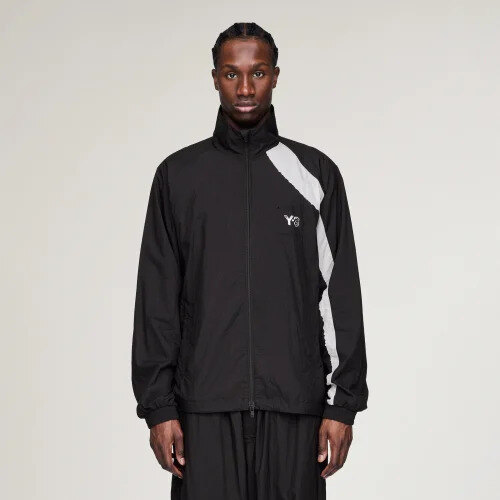 Blue lightweight zip jacket in the spirit of the Y-3 jacket from Quantum of Solace, laid flat with trousers and shoes